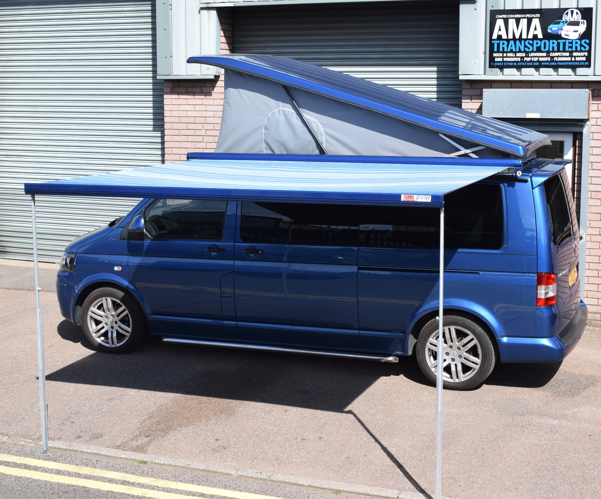 With Fiamma F45s awning and Austop Elevating roof.